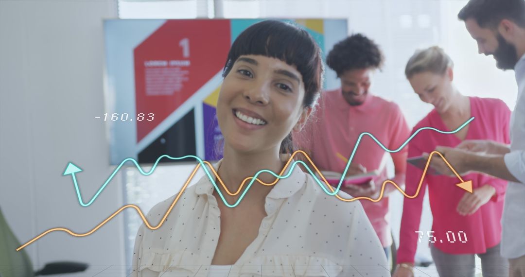 Diverse Team Working Through Analytics Data in Modern Office