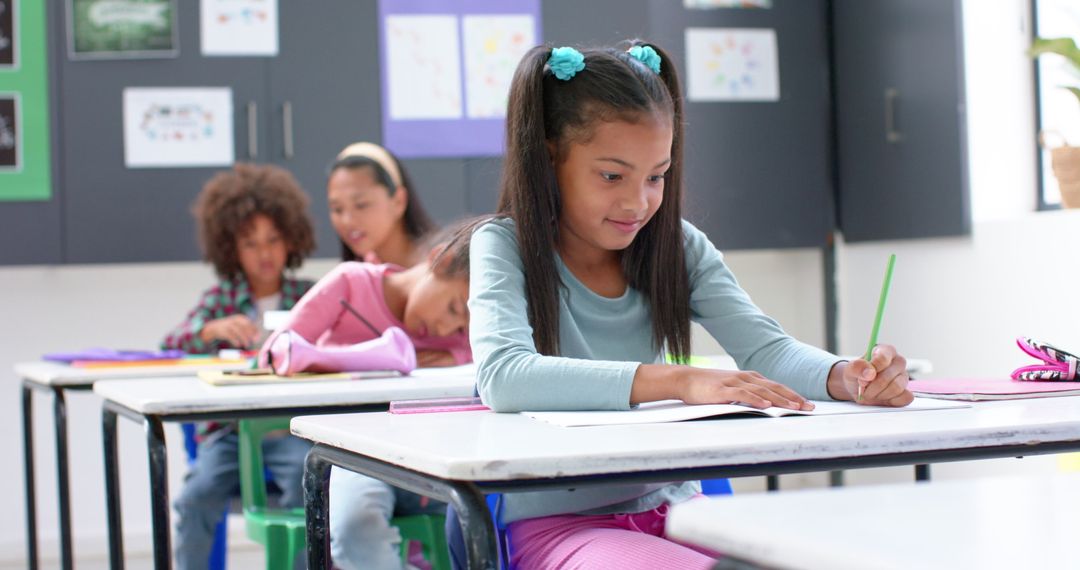 Diligent Schoolgirl Writing in Classroom Enhancing Learning