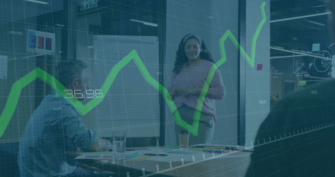 Businesswoman presenting analytics with rising green graph overlay in glass conference room