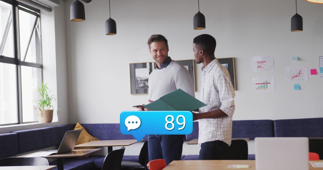 Coworkers Discuss Reports with Social Media Notification Overlay