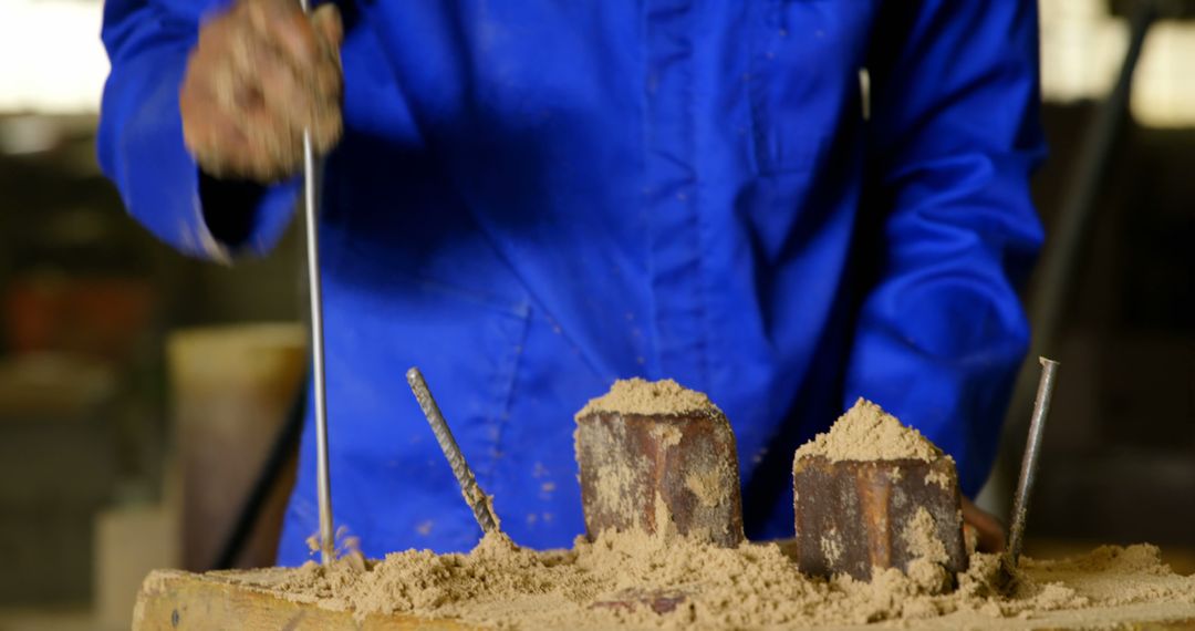 Worker Packing Soil into Mold for Casting Process - Free Images, Stock Photos and Pictures on Pikwizard.com