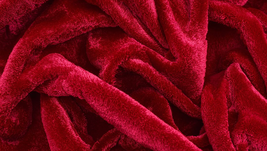 Crimson Plush Velvet Blanket Texture Closeup Showing Soft Pile and Luxurious Folds