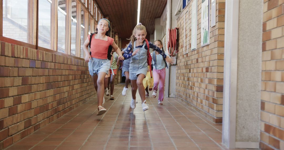 Cheerful Schoolchildren Joyfully Running Through Hallway