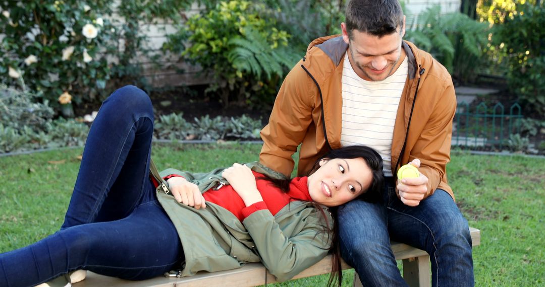 Couple Relaxing on Park Bench - Free Images, Stock Photos and Pictures on Pikwizard.com