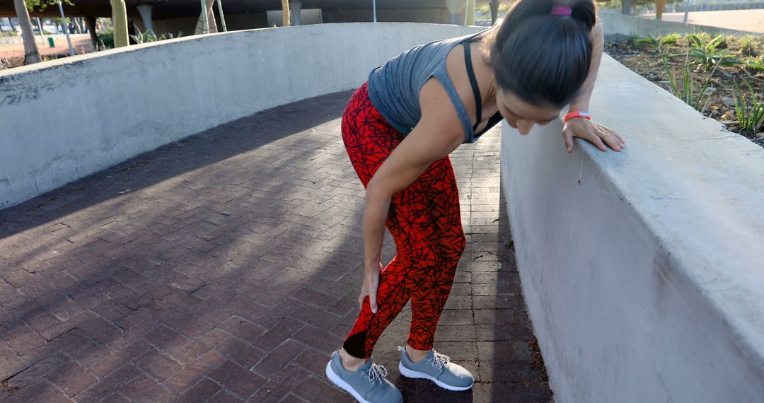 Woman Stretching Outside during Workout Session - Free Images, Stock Photos and Pictures on Pikwizard.com