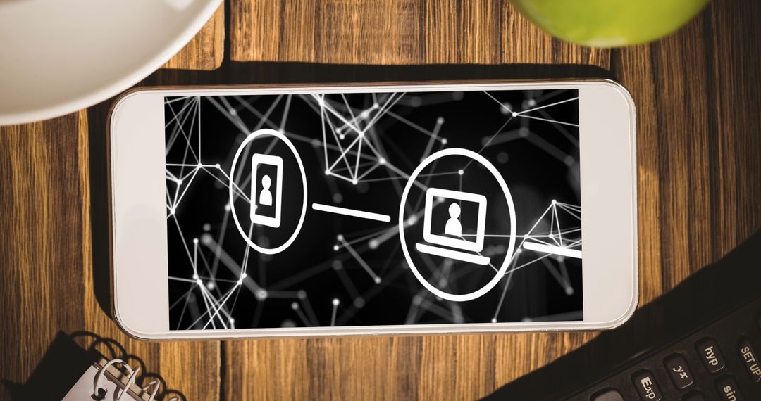 Smartphone Displaying Digital Interface on Wooden Desk Workspace