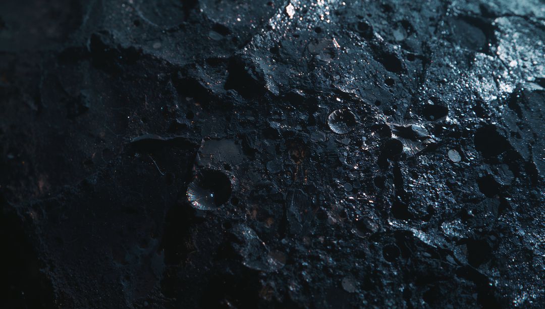 Cratered Rocky Surface on Lunar Terrain with Glossy Patches