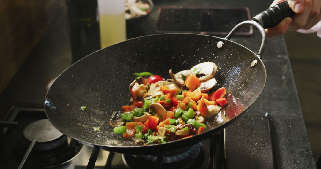 Chef Stir-Frying Colorful Vegetables in Pan - Free Images, Stock Photos and Pictures on Pikwizard.com