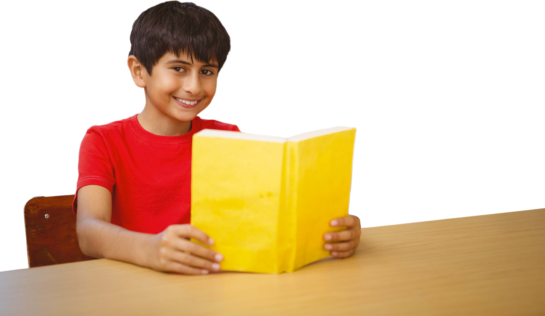 Smiling Boy Reading Transparent Book at Table - Download Free Stock Images Pikwizard.com