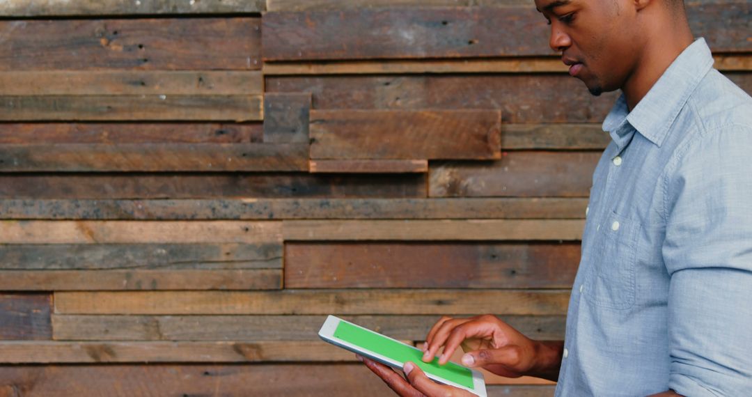 Business Professional Engaging with Tablet in Rustic Office