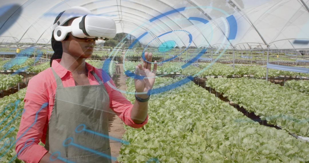Technician Using VR in Greenhouse for Precision Agriculture