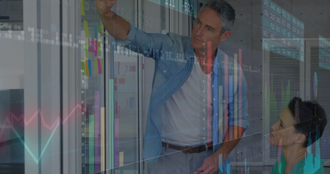 Teamwork Analyzing Data Insights on Interactive Glass Wall