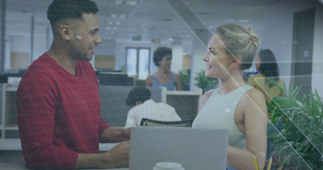 Colleagues Sharing Ideas in Modern Open-Plan Office