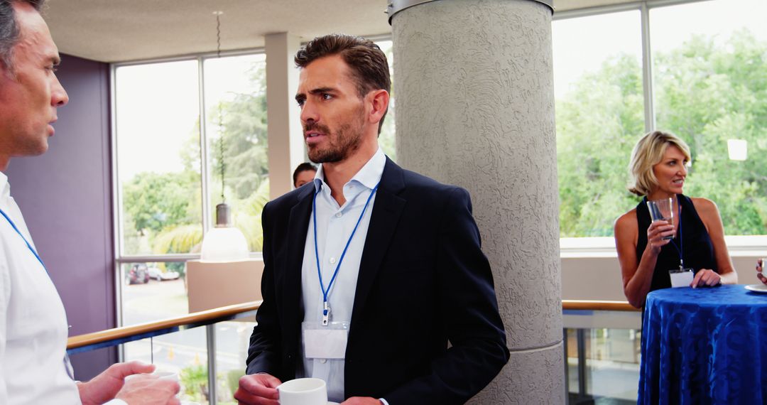 Professionals Networking During Conference Break with Copy Space