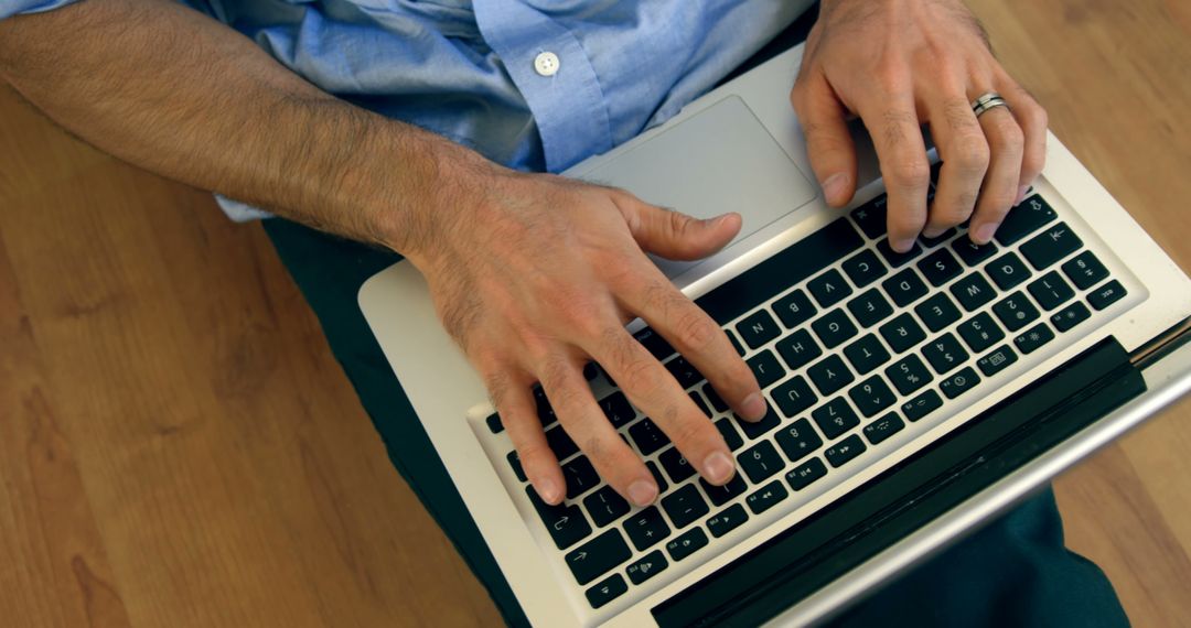 Close-up of hands typing on laptop keyboard, casual setting - Free Images, Stock Photos and Pictures on Pikwizard.com