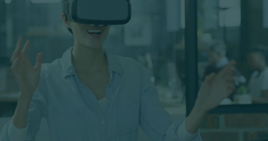 Young Professional Exploring Virtual Reality in Modern Office