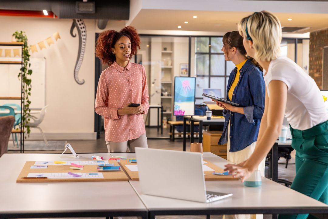 Diverse Team Discussing Project Plans in Modern Office Environment