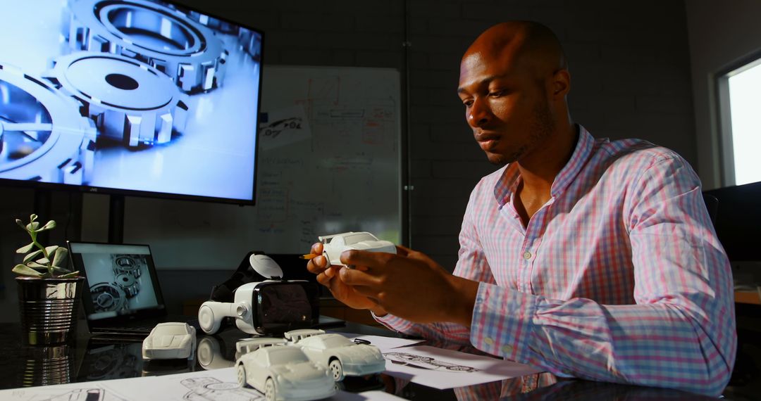 Executive Analyzing Car Prototype in Modern Office Environment