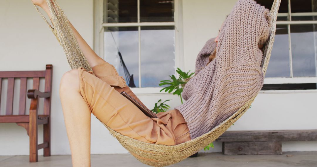 Woman Relaxing in Hammock at Home Terrace - Free Images, Stock Photos and Pictures on Pikwizard.com