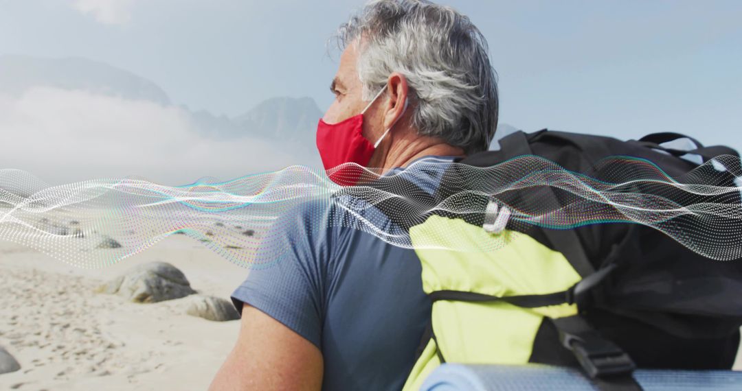 Mature Traveler Exploring Beach with Red Mask and Backpack