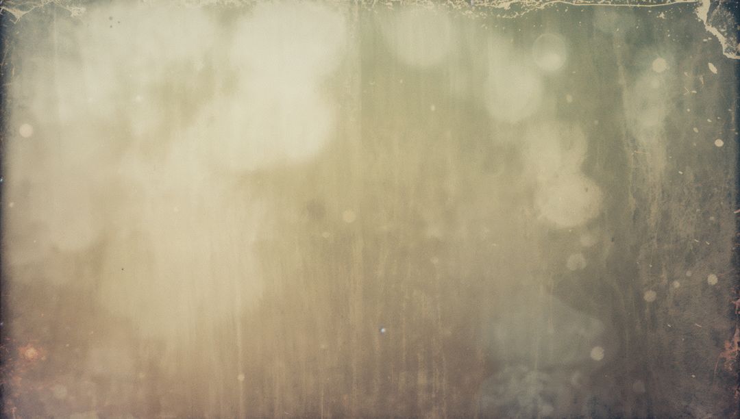 Vintage distressed parchment background with bokeh dust, scratches and frayed border