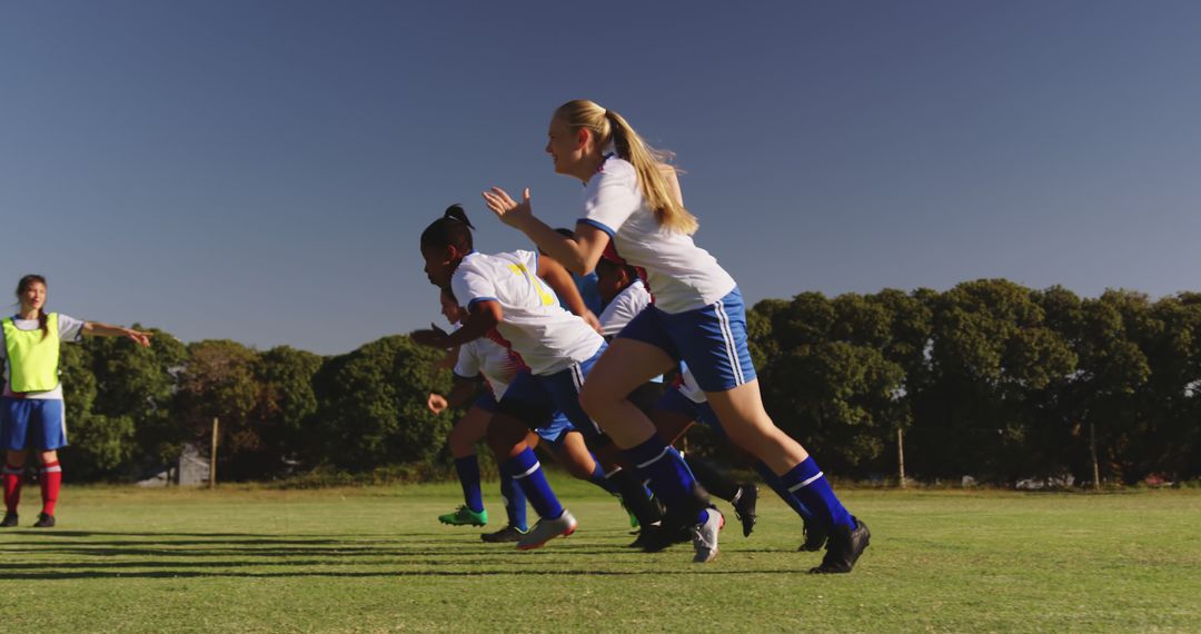 Youth Soccer Players Training and Sprinting Together in Field - Free Images, Stock Photos and Pictures on Pikwizard.com