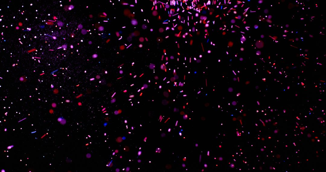 Vibrant confetti explodes against a dark background - Free Images, Stock Photos and Pictures on Pikwizard.com