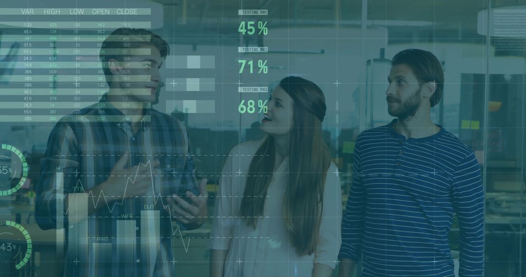 Team Analyzing Digital Data Interfaces in Modern Office