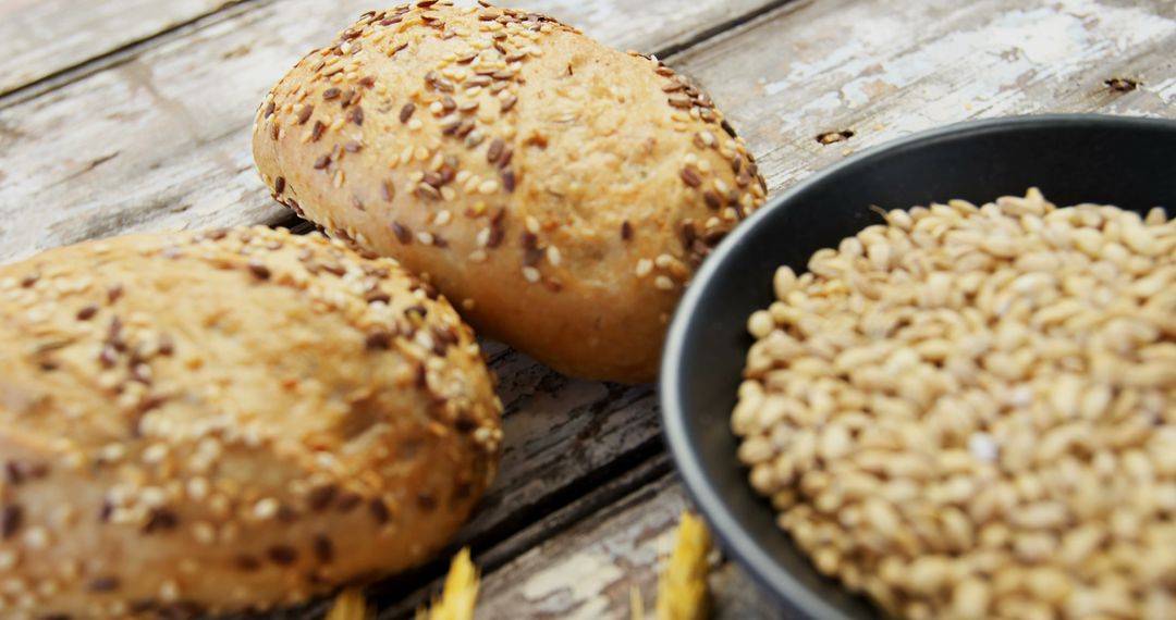 Wholegrain Bakery Rolls with Seeds on Rustic Wooden Table