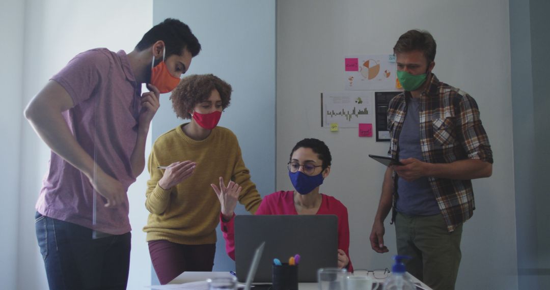 Diverse Team Collaboration Wearing Masks in Modern Office - Free Images, Stock Photos and Pictures on Pikwizard.com