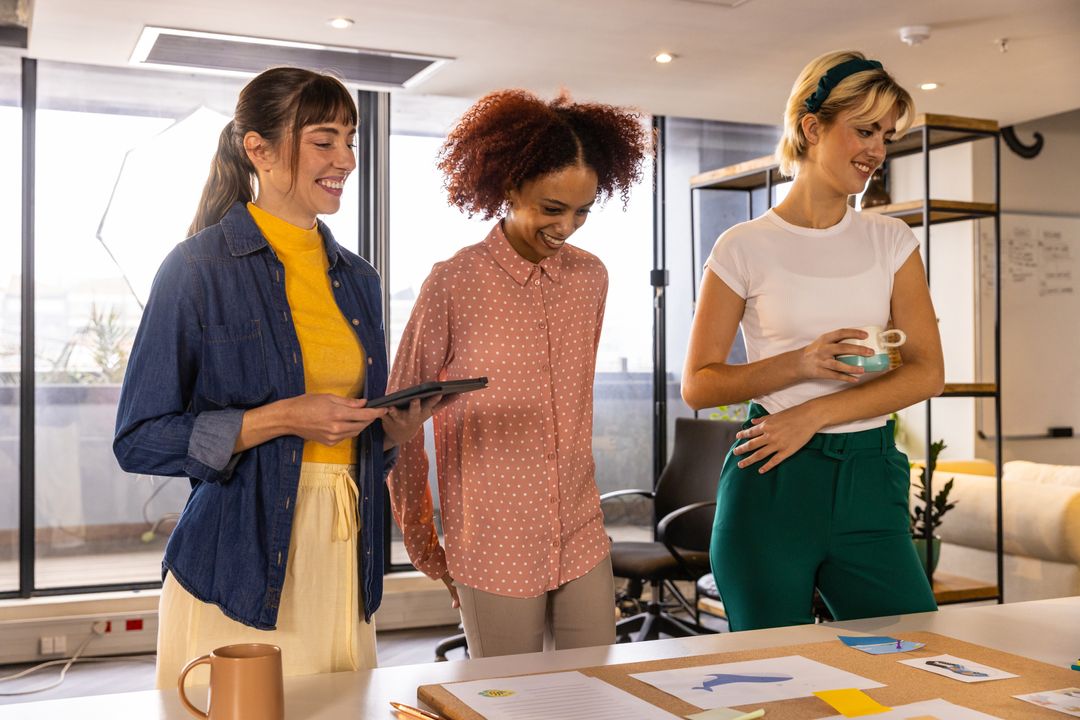 Diverse Coworkers Analyzing Charts in Modern Office