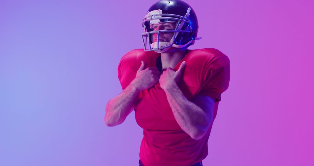 Image of caucasian american football player in helmet over neon purple background - Free Images, Stock Photos and Pictures on Pikwizard.com
