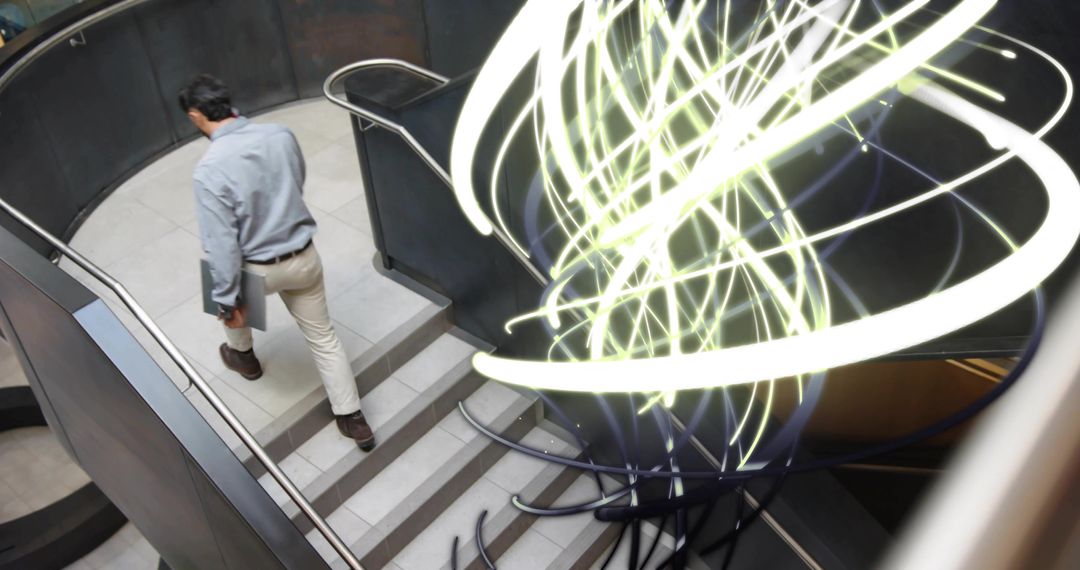 Businessman Descending Modern Spiral Staircase with Innovative Art Installations