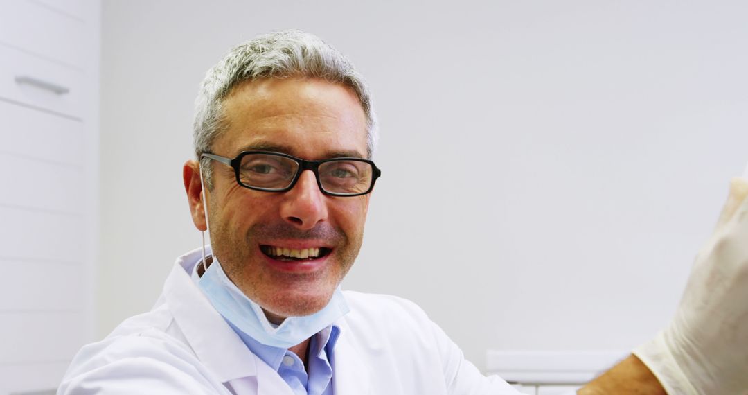 Smiling Male Doctor Wearing Glasses in White Lab Coat - Free Images, Stock Photos and Pictures on Pikwizard.com