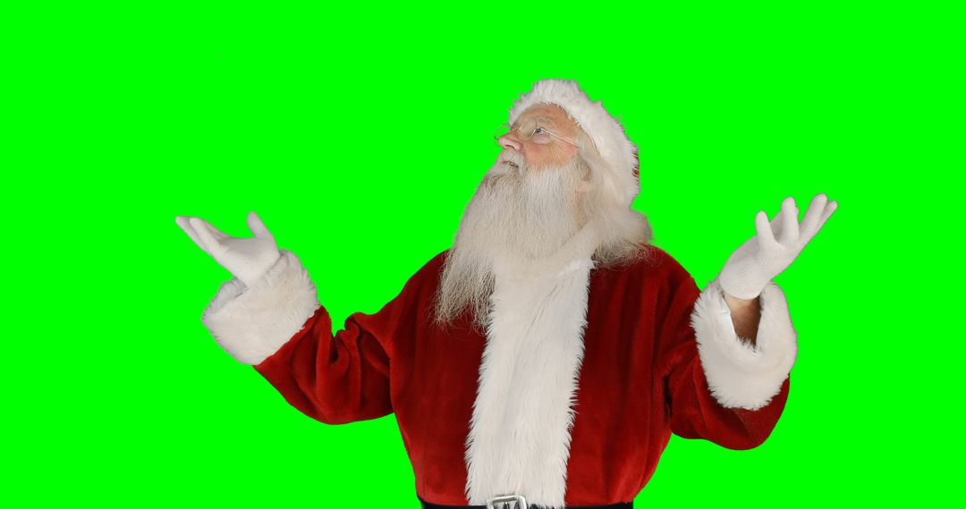 Santa Claus Gesturing Upwards with Green Background - Free Images, Stock Photos and Pictures on Pikwizard.com