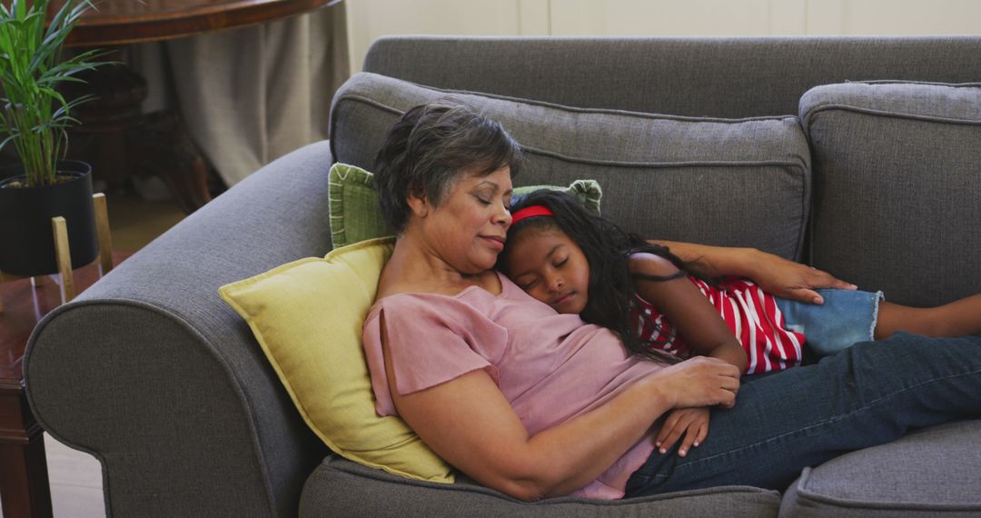 Grandmother and Granddaughter Napping on Sofa - Free Images, Stock Photos and Pictures on Pikwizard.com