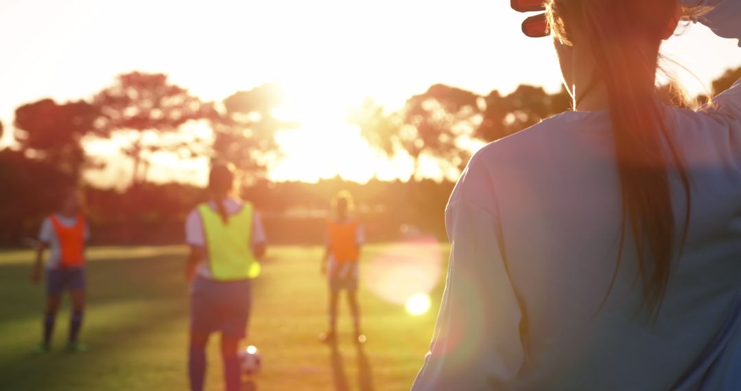 Women Soccer Players Practicing at Sunset - Free Images, Stock Photos and Pictures on Pikwizard.com