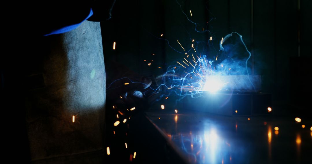 Close-up of Welder Working with Bright Sparks - Free Images, Stock Photos and Pictures on Pikwizard.com