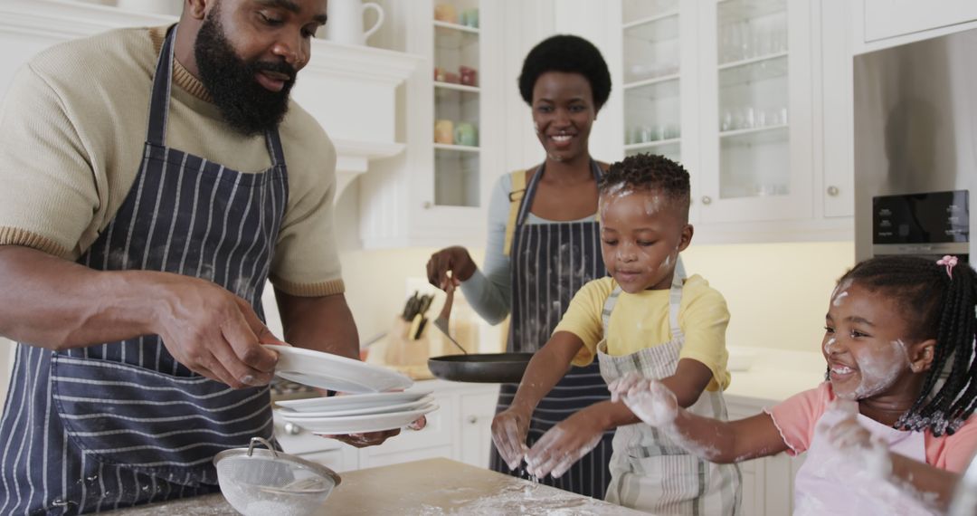 Happy African American Family Making Pancakes During Breakfast at Home - Free Images, Stock Photos and Pictures on Pikwizard.com