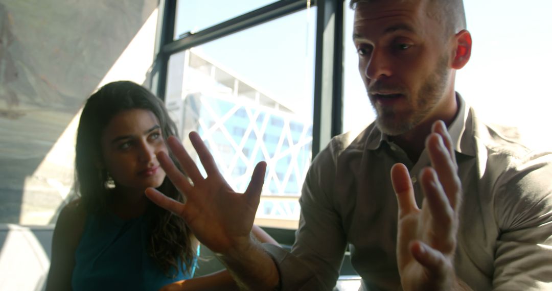 Serious Conversation Between Business Colleagues in Office Setting