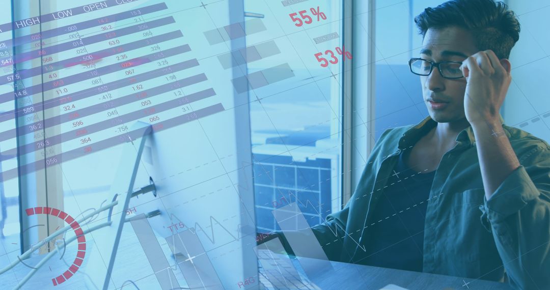 Businessman Analyzing Financial Data on Computer Screen Office Graphs