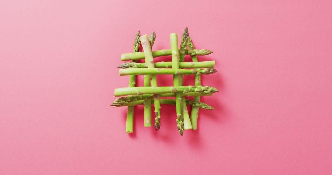 Creative Arrangement of Asparagus on Vibrant Pink Background - Free Images, Stock Photos and Pictures on Pikwizard.com