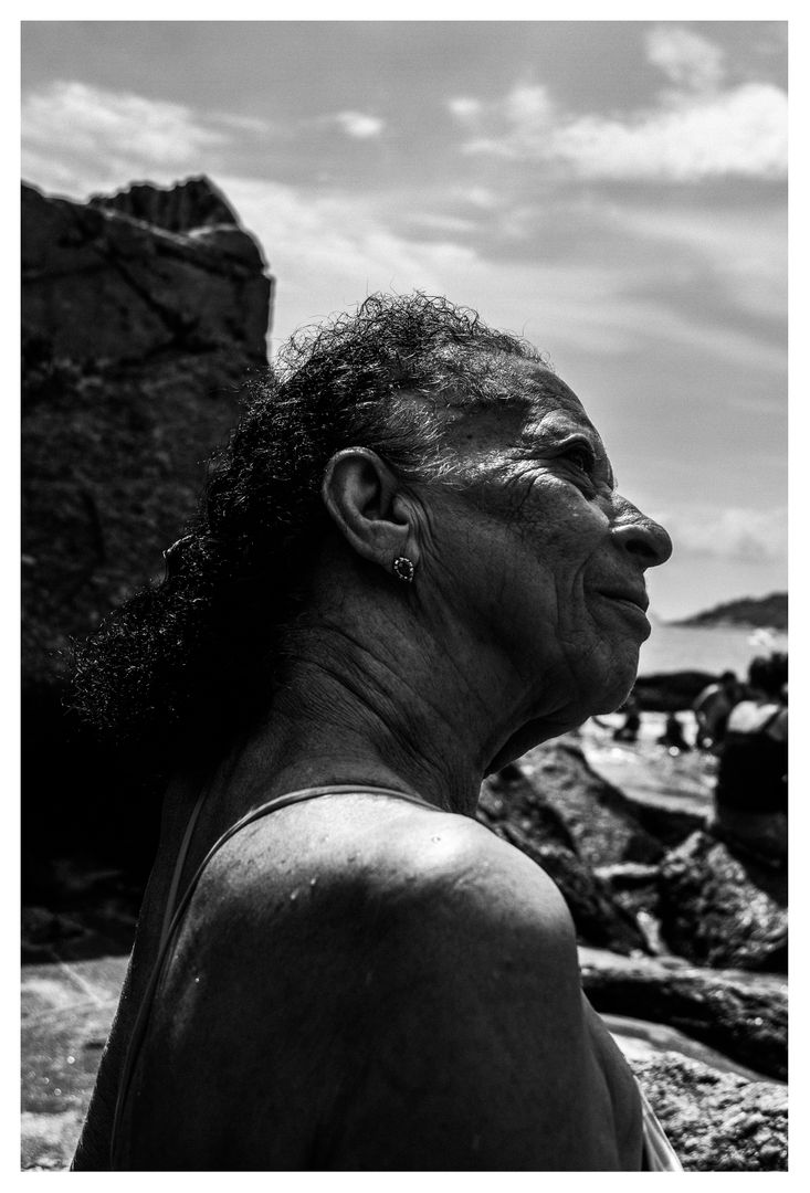 Elderly Woman Enjoying Nature at the Beach - Free Images, Stock Photos and Pictures on Pikwizard.com