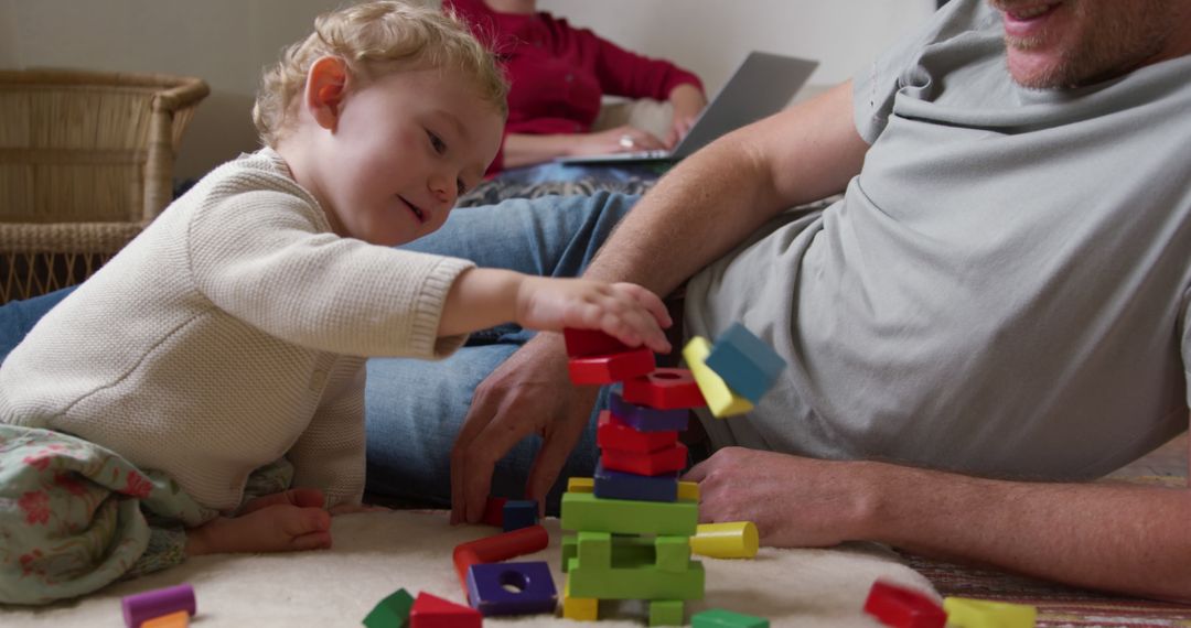 Father and Child Bonding with Colorful Building Blocks - Free Images, Stock Photos and Pictures on Pikwizard.com