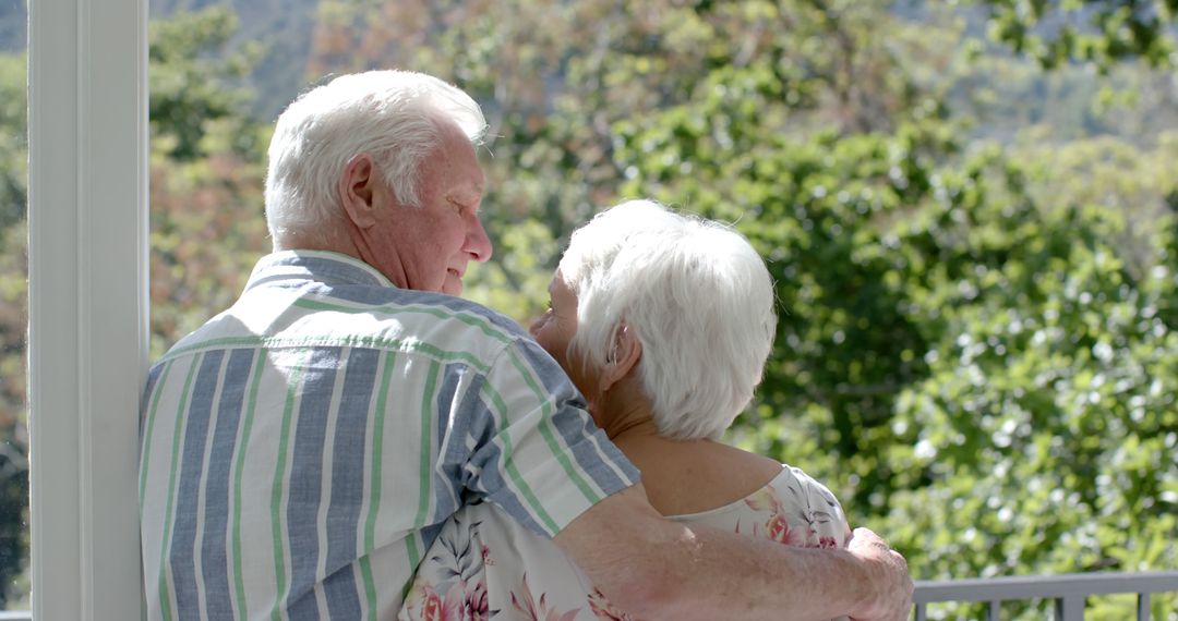 Loving Senior Couple Embracing Outdoors with Greenery Background - Free Images, Stock Photos and Pictures on Pikwizard.com