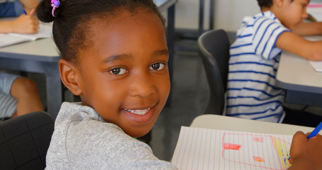 Smiling Schoolgirl Engaged in Classroom Activities