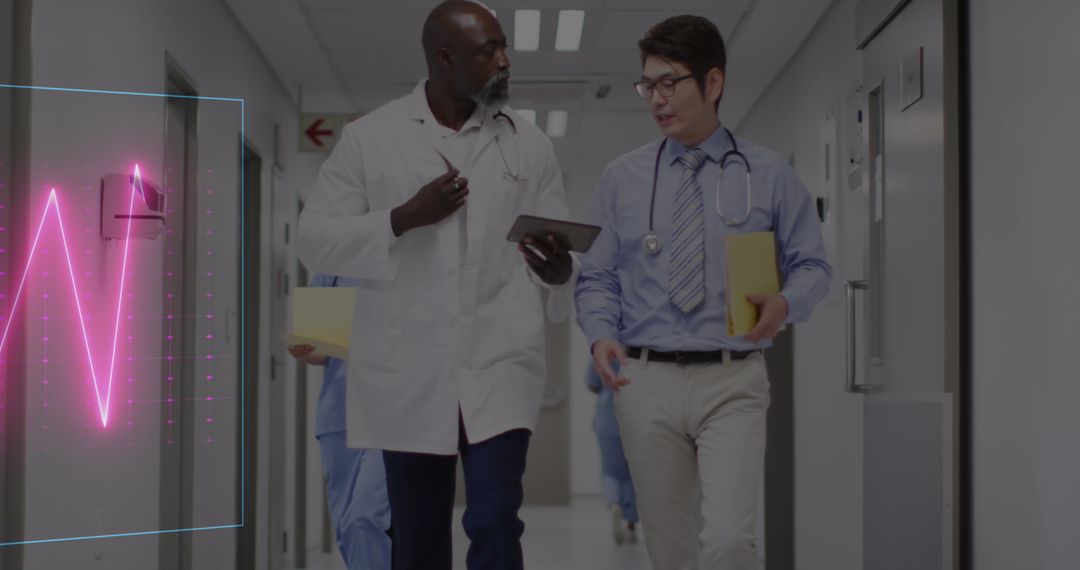 Doctors Discussing Medical Data in Hospital Corridor