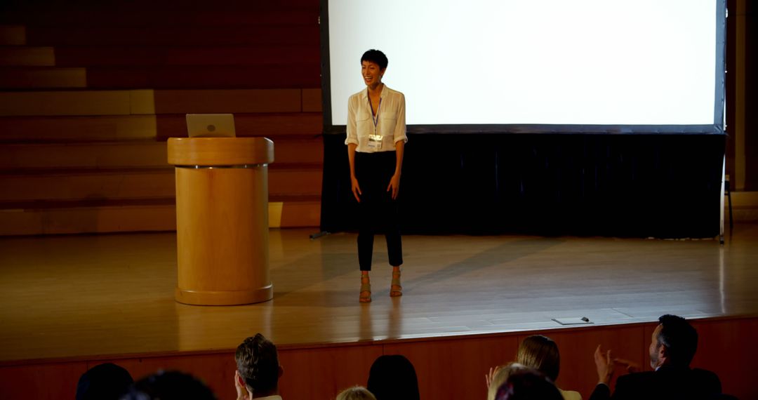 Businesswoman Presenting in Modern Conference Room with Large Screen - Free Images, Stock Photos and Pictures on Pikwizard.com