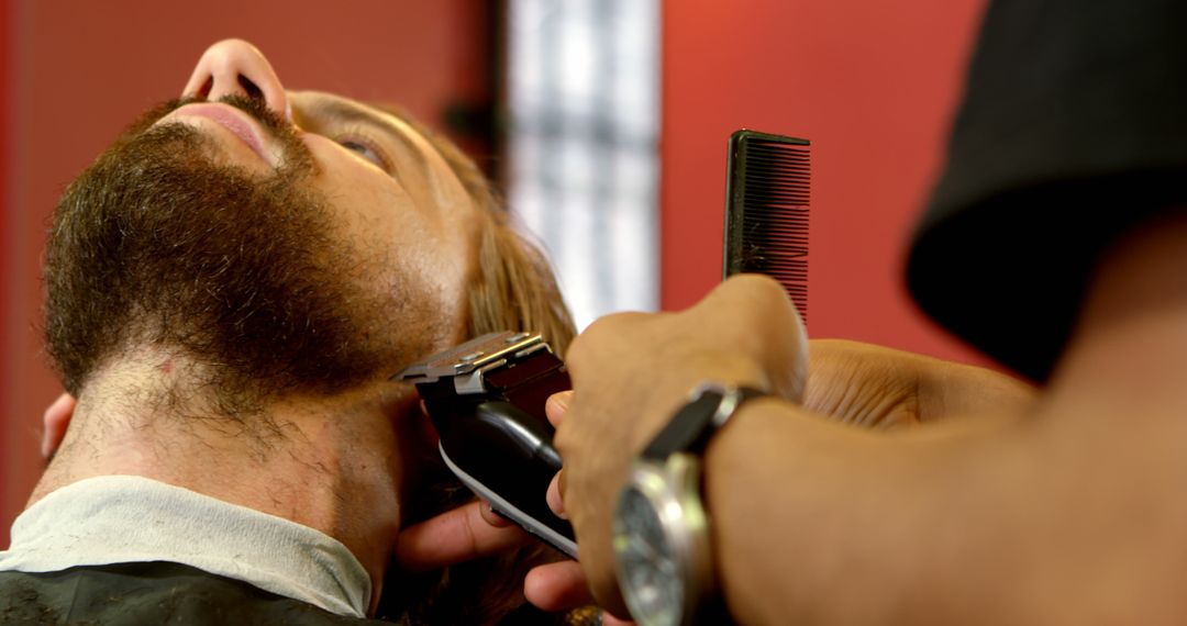 Barber Trimming Beard of Bearded Man - Free Images, Stock Photos and Pictures on Pikwizard.com