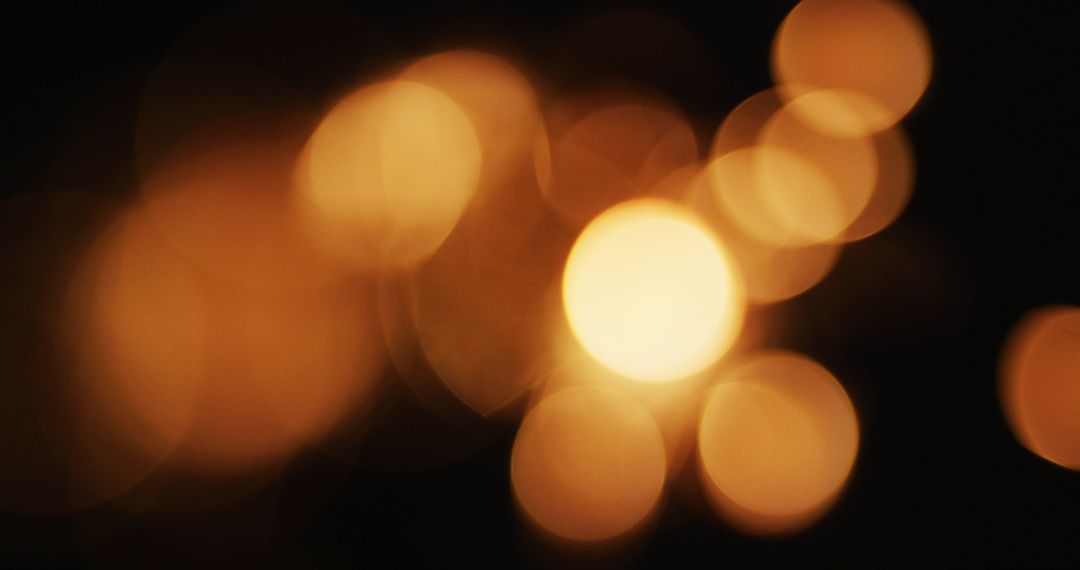 Abstract Warm Orange Bokeh Lights on Dark Background - Free Images, Stock Photos and Pictures on Pikwizard.com